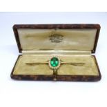An antique 15ct yellow gold pearl broach set with a greenstone, size of setting 15mm x 13mm.