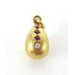 An 18ct ruby and diamond egg pendant.