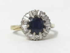 An 18ct sapphire and diamond cluster ring, size K.