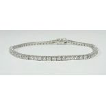 A diamond line bracelet, containing approx. 2.8 carats of diamond, length 18cm.