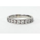 A 9ct diamond and half band eternity ring with ten round brilliant cut diamonds, weight approx. 0.