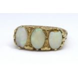 A 9ct opal three stone ring, size T.