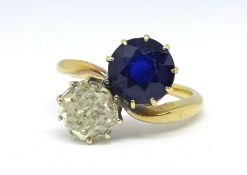 A sapphire and diamond crossover ring, diamond approx. 1.50 carats, size M.