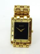 Gucci, a gents gold plated wrist watch.