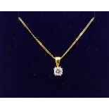 An 18ct diamond set pendant on a fine gold chain.