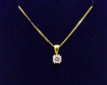 An 18ct diamond set pendant on a fine gold chain.