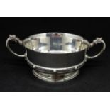 A Geo V Arts and Crafts style silver bowl with dragon handles, maker A.Bros, Birmingham 1917,