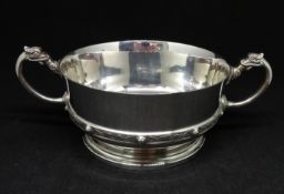 A Geo V Arts and Crafts style silver bowl with dragon handles, maker A.Bros, Birmingham 1917,