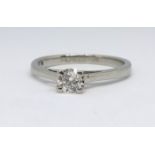 A platinum a diamond solitaire ring, size N.