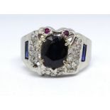 An 18ct white gold sapphire and diamond cluster ring, size X.
