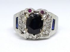 An 18ct white gold sapphire and diamond cluster ring, size X.
