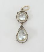 An aqua- marine and diamond set pendant.