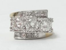 An impressive 14k diamond set ring, diamond set in three rows, the centre row with three diamonds