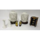 A 20th century Chinese table cabinet, a pair of pierced modern oriental jars and stands, carved