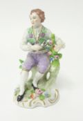 A 19th century Sitzendorf porcelain figure modelled as a Gardener, under Alfred Voigt, underglaze