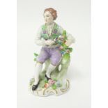 A 19th century Sitzendorf porcelain figure modelled as a Gardener, under Alfred Voigt, underglaze