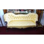 A Victorian mahogany framed double end chaise longue, button back, upholstered with dragon fly