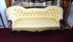 A Victorian mahogany framed double end chaise longue, button back, upholstered with dragon fly