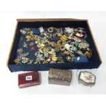 A collection of various dress brooches and three small jewellery boxes.
