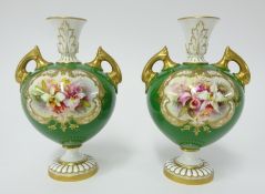 Royal Worcester, pair of porcelain vases decorated with panels of flowers on the green ground with