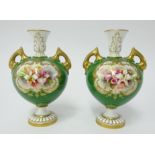 Royal Worcester, pair of porcelain vases decorated with panels of flowers on the green ground with
