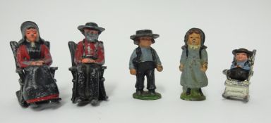 Five small vintage painted lead figures modelled as American Amish figures (three in rocking