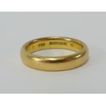 A 22ct wedding band, weight 9.50g.