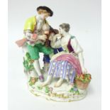 An early 20th century Meissen porcelain group, modelled as 'Two Lovers, and Attendant' , incised