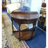 An oak 'demi lune' hall table, fitted with a drawer.