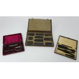 Set of printing blocks, and two vintage travel sets, manicure and gloves, all cased (3).