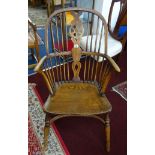 A Windsor farmhouse 'wheelback' chair.