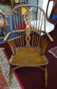 A Windsor farmhouse 'wheelback' chair.