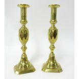 A pair of brass candlesticks early 20th century, height 30cm.