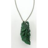 A carved green Jade pendant and chain, height 60mm.