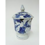 A Chinese porcelain blue and white stem cup and cover, repaired, height 19cm.