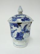 A Chinese porcelain blue and white stem cup and cover, repaired, height 19cm.