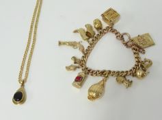 A 9ct gold charm bracelet, together with a 9ct gold pendant necklace, total weight approx. 44g.