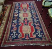 A 20th century Caucasian rug, 300cm x 144cm