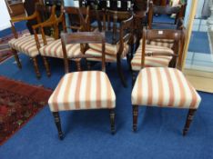 A matched set of eleven 19th century mahogany framed dining chairs with rope bar backs and turned