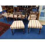 A matched set of eleven 19th century mahogany framed dining chairs with rope bar backs and turned