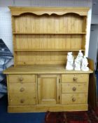 A 19th century pine dresser, with a later top shelf unit, width 168cm.