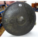 A bronze Tibetan style temple 'nipple' gong, diameter 44cm.