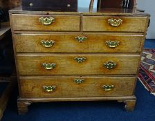 A Georgian oak chest, fitted with two short and three long drawers on bracket feet, with polished