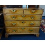 A Georgian oak chest, fitted with two short and three long drawers on bracket feet, with polished