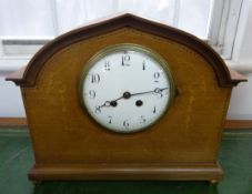 An Edwardian mahogany and marquetry inlaid mantle clock with 8 day movement.