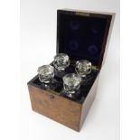 A 19th century decanter, boxed in burr walnut containing two spirit liqueur decanters, height 22cm.