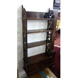 A Victorian wall hanging bookcase fitted with drawers.