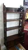 A Victorian wall hanging bookcase fitted with drawers.