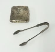 A silver cigarette case and silver sugar tongs.