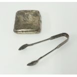 A silver cigarette case and silver sugar tongs.